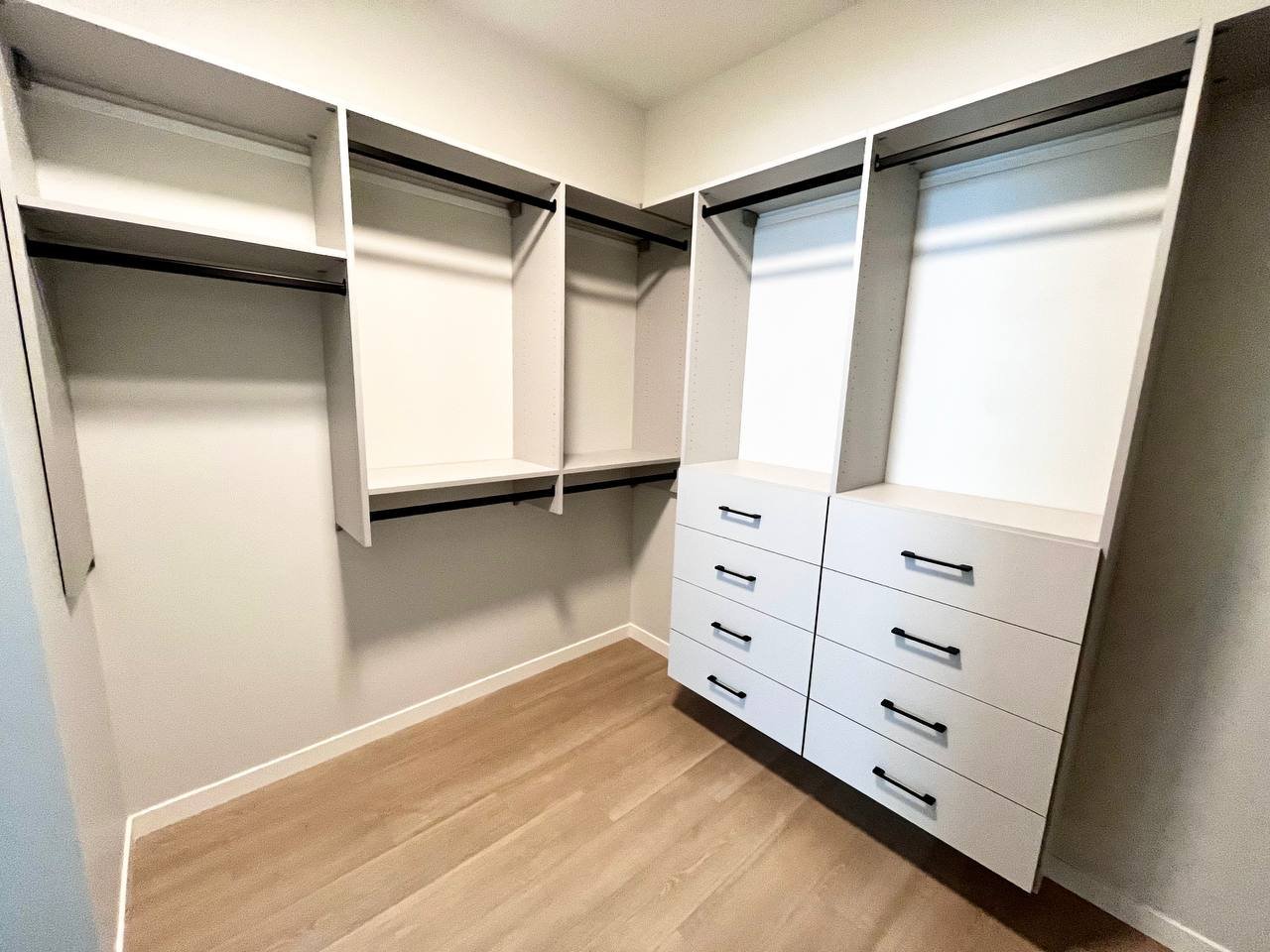 Matte grey master closet with drawers by Bow Wood Co. Calgary
